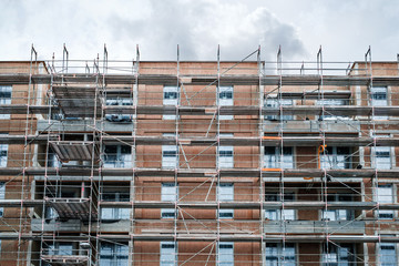 scaffolding on  house facade, apartment buildingwith scaffold