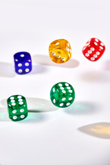 colorful dices in motion on white background