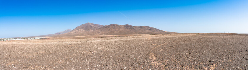 Panoramic view desert region  Playa Blanca Papagayo - White Beach Papagayo, - at volcanic island Lanzarote, Canary Islands, Spain.  Travel vacation concept.