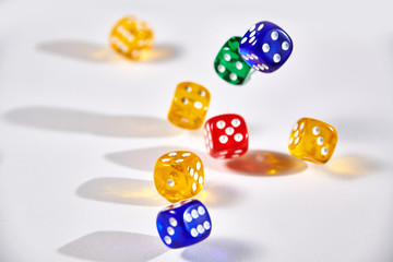 colorful dices in motion on white background