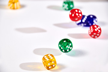 colorful dices in motion on white background
