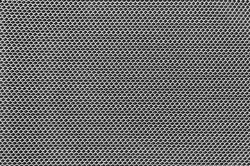 photo of textured surface of uniformly distributed grid pattern similar to chain fastening in...