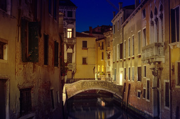 Obraz na płótnie Canvas Venice canal view at night with bridge and historical buildings. Italy
