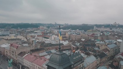 Aerial Shot Ukrainian Flag Flying on Top of Lviv Opera. European City.