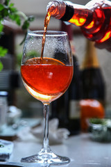 Aperol spritz cocktail in glass on wooden table