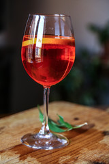 Aperol spritz cocktail in glass on wooden table