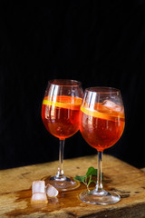 Aperol spritz cocktail in glass on wooden table