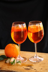 Aperol spritz cocktail in glass on wooden table