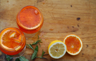 Aperol spritz cocktail in glass on wooden table