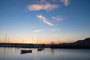 Naklejka premium Port of Morro Del Jable on sunset on the Canary Island Fuerteventura.