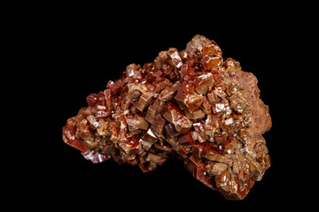 Macro mineral stone Vanadinite on a black background