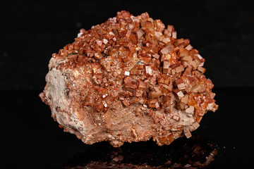 Macro mineral stone Vanadinite on a black background