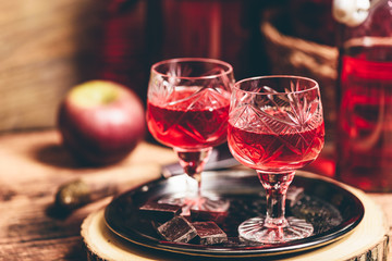 Homemade berry alcoholic beverage and chocolate