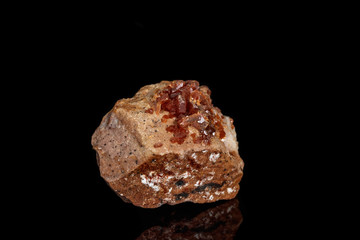 Macro mineral stone Vanadinite on a black background