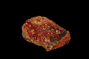 Macro mineral stone Vanadinite on a black background
