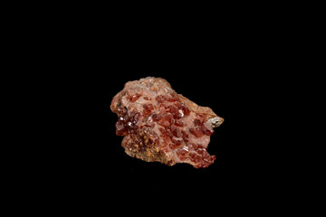 Macro mineral stone Vanadinite on a black background