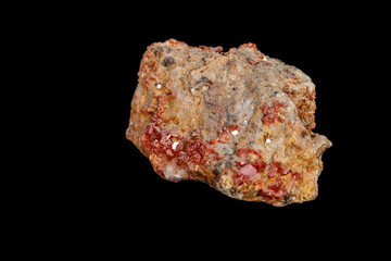 Macro mineral stone Vanadinite on a black background