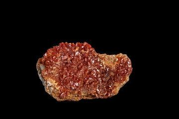 Macro mineral stone Vanadinite on a black background