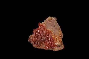 Macro mineral stone Vanadinite on a black background