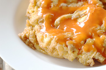 Omelet with chili sauce