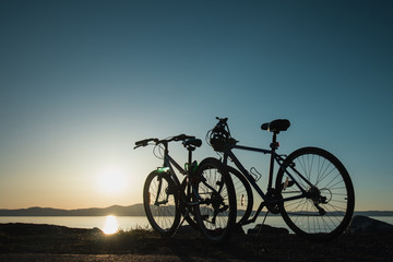 Fototapeta na wymiar Sunset with bikes
