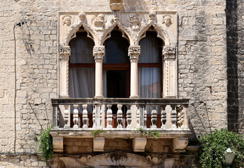 Fototapeta na wymiar antique window with a balcony in Croatia