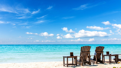 Summer vacation background. deckchairs on white sand beach and ocean sea. Travel and relax with holiday.