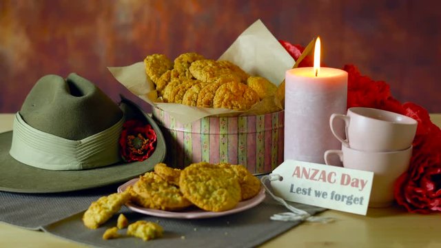 Traditional ANZAC biscuits for ANZAC Day and Remembrance Day memorial holidays in vintage style setting with Australian army slouch hat.