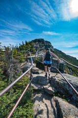 female hiker enjoying the view from the trail to the summit of Whiteface Mountain