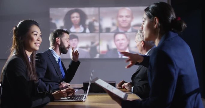 4K Multiracial business team having a conference meeting connected by video link