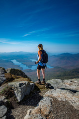 female hiker enjoying the view from the summit of Whiteface Mountain