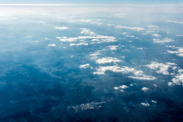 Top view of white clouds above the city
