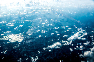 Top view of white clouds above the water