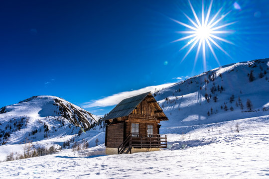 wooden hut in mountains in ski resort isola 2000, france