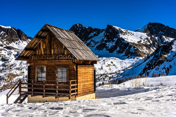 Fototapeta na wymiar wooden hut in mountains in ski resort isola 2000, france