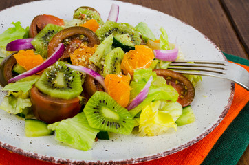 Fruit and vegetable salad with tangerines.