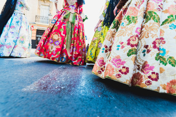 Valencia, Spain - March 17, 2019: Detail of the typical fallero dress, during the colorful and traditional parade of the offering, handmade embroidered dresses for the falleras.