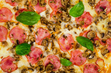 Background, texture of pizza with ham and mushrooms.