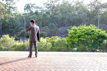 Smart dressed man looking at his watch