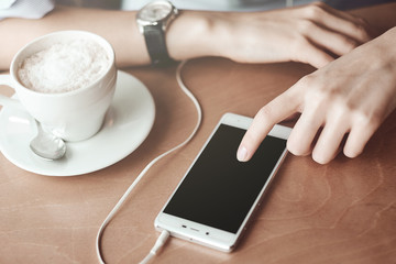 Business woman hands with smart phone and cup of coffee. For Graphic display montage.