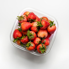 Fresh Strawberry in a Bowl Isolated on White Background.
