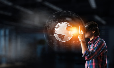 Fototapeta premium Experiencing virtual technology world. Mixed media