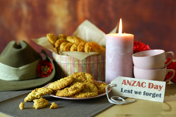 Traditional ANZAC biscuits for ANZAC Day and Remembrance Day memorial holidays in vintage style setting with Australian army slouch hat.