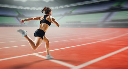 Fototapeta premium Sportswoman running race. Mixed media