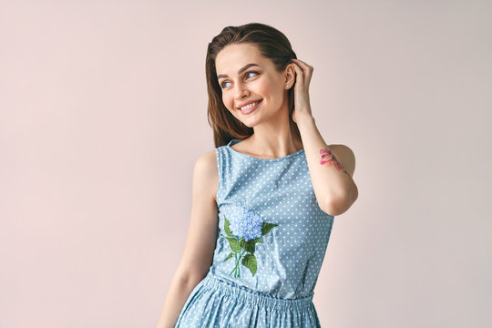 Pretty Sensual Woman In Polka Dot Dress Posing In Studio