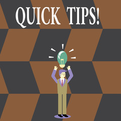 Writing note showing Quick Tips. Business concept for small but particularly useful piece of practical advice Businessman Raising Arms Upward with Lighted Bulb icon above