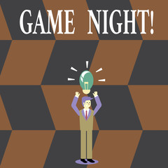 Writing note showing Game Night. Business concept for usually its called on adult play dates like poker with friends Businessman Raising Arms Upward with Lighted Bulb icon above