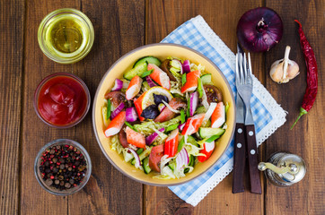 Vegetable salad with surimi crab sticks.