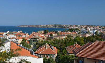 Fototapeta na wymiar Seaside landscape - view from the cafe on the embankment in the town of Sozopol on the Black Sea coast in Bulgaria