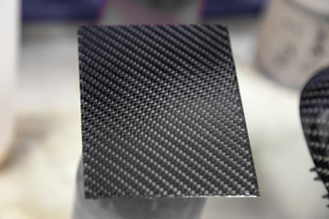 Carbon plate gray and black in the form of weaving from Kevlar, a very durable and lightweight...
